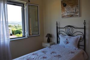 Postel nebo postele na pokoji v ubytování Marilias house