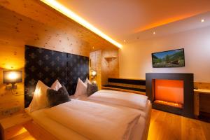 Postel nebo postele na pokoji v ubytování Hotel Alpina