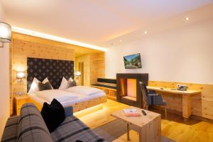 Postel nebo postele na pokoji v ubytování Hotel Alpina