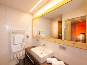 Koupelna v ubytování Hotel Alpina