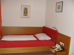 Postel nebo postele na pokoji v ubytování Hotel Bischof