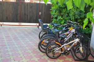 a group of bikes parked next to a fence at Buhta Udachi Mini-hotel in Gelendzhik