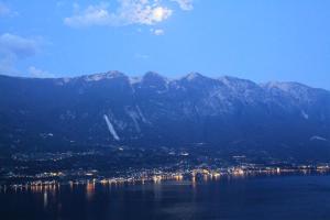 a view of a large body of water with mountains at Casa Bine in Tremosine Sul Garda
