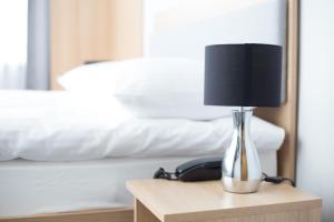 Postel nebo postele na pokoji v ubytování Waw Hotel Airport Okęcie