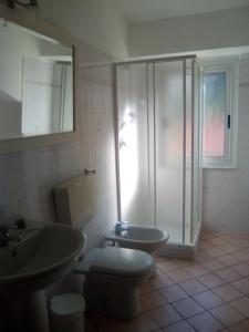 a bathroom with a shower and a toilet and a sink at B & B Abbadia in Monesiglio +44 photos