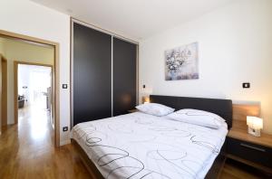 a bedroom with a large bed in a room at Precko7NEW in Zagreb