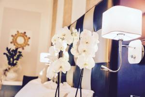Voodi või voodid majutusasutuse JR Resort Logos Forte dei Marmi toas