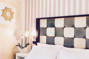 Voodi või voodid majutusasutuse JR Resort Logos Forte dei Marmi toas