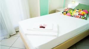 A bed or beds in a room at B&B Alta Marea Pozzallo