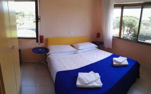 Postel nebo postele na pokoji v ubytování Hotel Elizabeth
