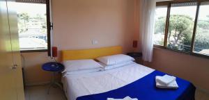 Postel nebo postele na pokoji v ubytování Hotel Elizabeth