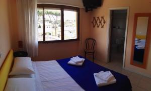 Postel nebo postele na pokoji v ubytování Hotel Elizabeth