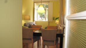 a dining room with a table and chairs at Foz Gardens in Porto +8 photos