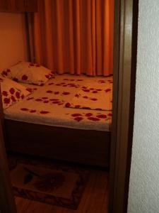 Un pat sau paturi într-o cameră la Guest House Valentino
