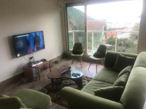 Et opholdsområde på Holiday Home Sunrise