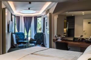 Postel nebo postele na pokoji v ubytování Best Western Premier Natalija Residence