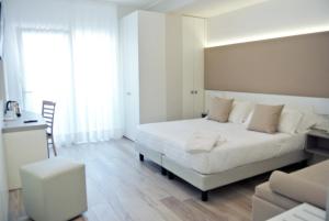 Cama ou camas em um quarto em Hotel Bologna