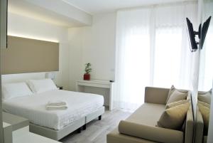 Cama ou camas em um quarto em Hotel Bologna