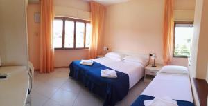 Postel nebo postele na pokoji v ubytování Hotel Elizabeth