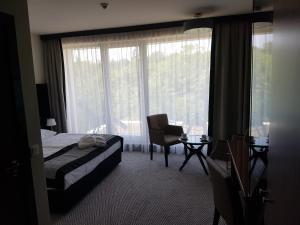 Posteľ alebo postele v izbe v ubytovaní Apartament prywatny 329 w Diune Resort