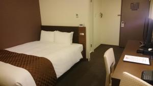Postel nebo postele na pokoji v ubytování Hotel Ascent Plaza Hamamatsu