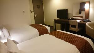 Postel nebo postele na pokoji v ubytování Hotel Ascent Plaza Hamamatsu