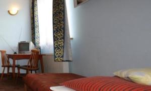 Cama o camas de una habitación en U Schabińskiej - Pokoje Gościnne