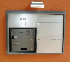 a microwave oven is mounted on a wall at Hotel Restaurant Jura in Kerzers