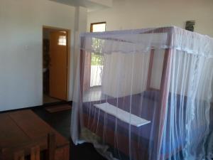 Letto o letti in una camera di Sunstyle Mirissa Guest House
