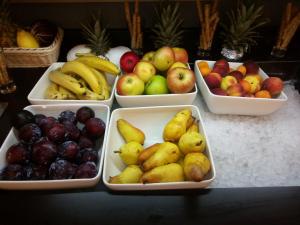 a bunch of bowls of fruit on a table at Villas Arbia - Rio by the Beach in Rab