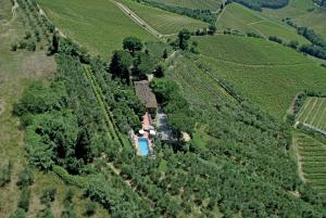an aerial view of a house in the middle of a field at Agriturismo Vernianello in Poggibonsi