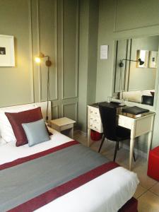 Postel nebo postele na pokoji v ubytování Le Panoramic Boutique Hôtel