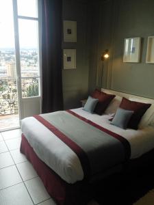Postel nebo postele na pokoji v ubytování Le Panoramic Boutique Hôtel
