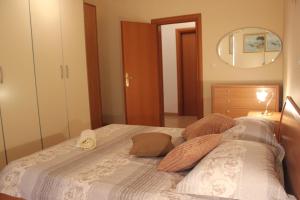 Postel nebo postele na pokoji v ubytování Apartments Lucija