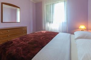 Postel nebo postele na pokoji v ubytování Apartman Sabljak