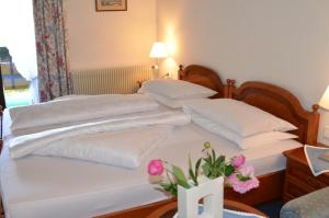 Postel nebo postele na pokoji v ubytování Hotel Brandl