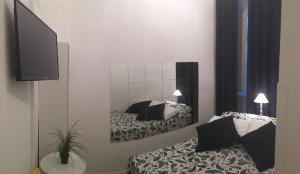 A bed or beds in a room at MiRhome Guest House