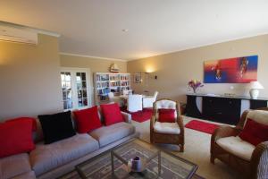 a living room with a couch and chairs and a table at Apartment Valeriana in Lagos