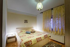 Postel nebo postele na pokoji v ubytování Apartments Jasna