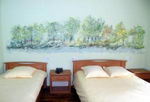 Postel nebo postele na pokoji v ubytování Hotel Champ Alsace
