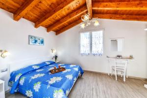 Giường trong phòng chung tại Isola Antica