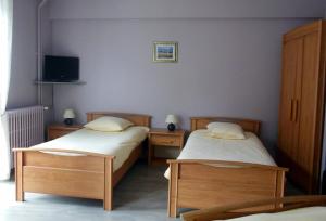 Postel nebo postele na pokoji v ubytování Hotel Champ Alsace