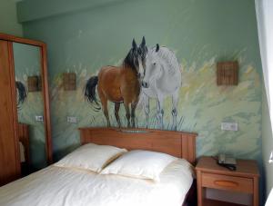 Postel nebo postele na pokoji v ubytování Hotel Champ Alsace