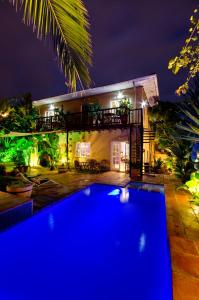 a villa with a swimming pool at night at Villa Costa Rose - No Loadshedding in Cape Town