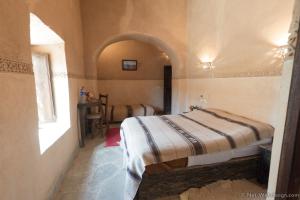 Voodi või voodid majutusasutuse Kasbah Imdoukal toas
