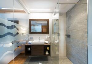 Koupelna v ubytování Hotel Alpina