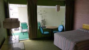 Postel nebo postele na pokoji v ubytování Caribbean Motel