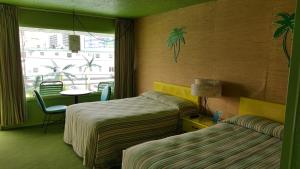 Postel nebo postele na pokoji v ubytování Caribbean Motel