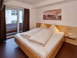 Кровать или кровати в номере Apart Benedikt