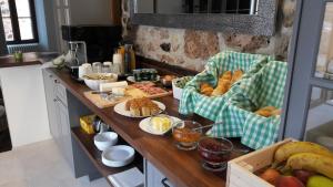 a kitchen with a counter with breakfast foods on it at Villa Arca in Les Arcs sur Argens